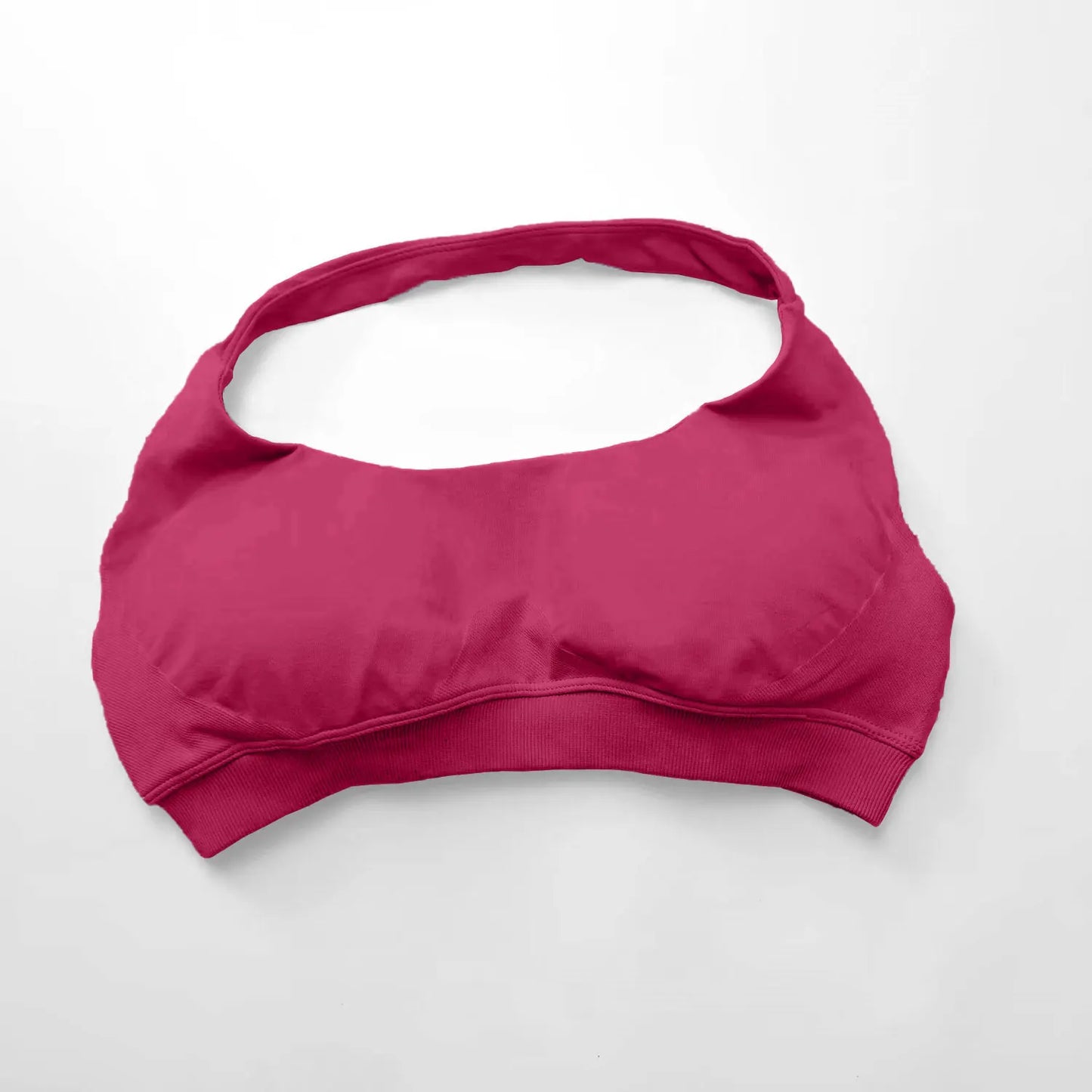 Pink bikini top on a white background