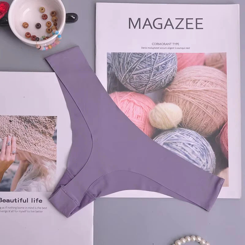 Purple underwear on a magazine with yarn balls on the cover