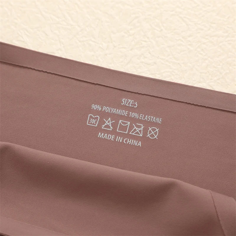 Fabric with care label and material information on a beige background