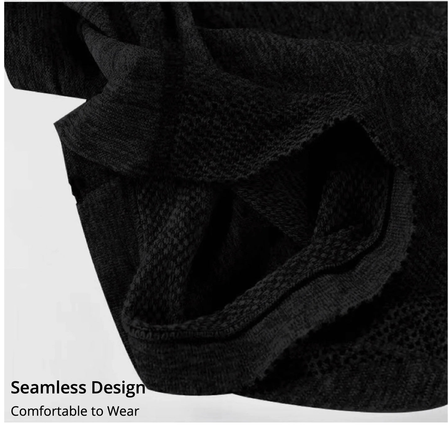 Close-up of black fabric with 'Seamless Design' text on a white background