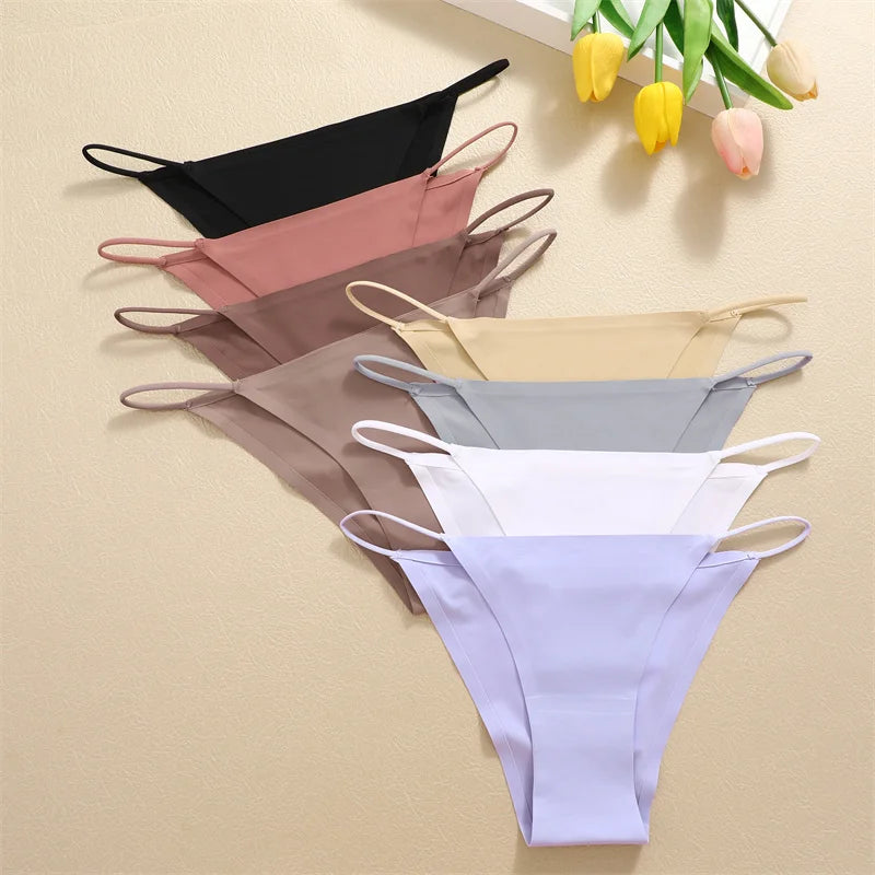 Set of six bikini bottoms in various colors on a beige background with tulips.