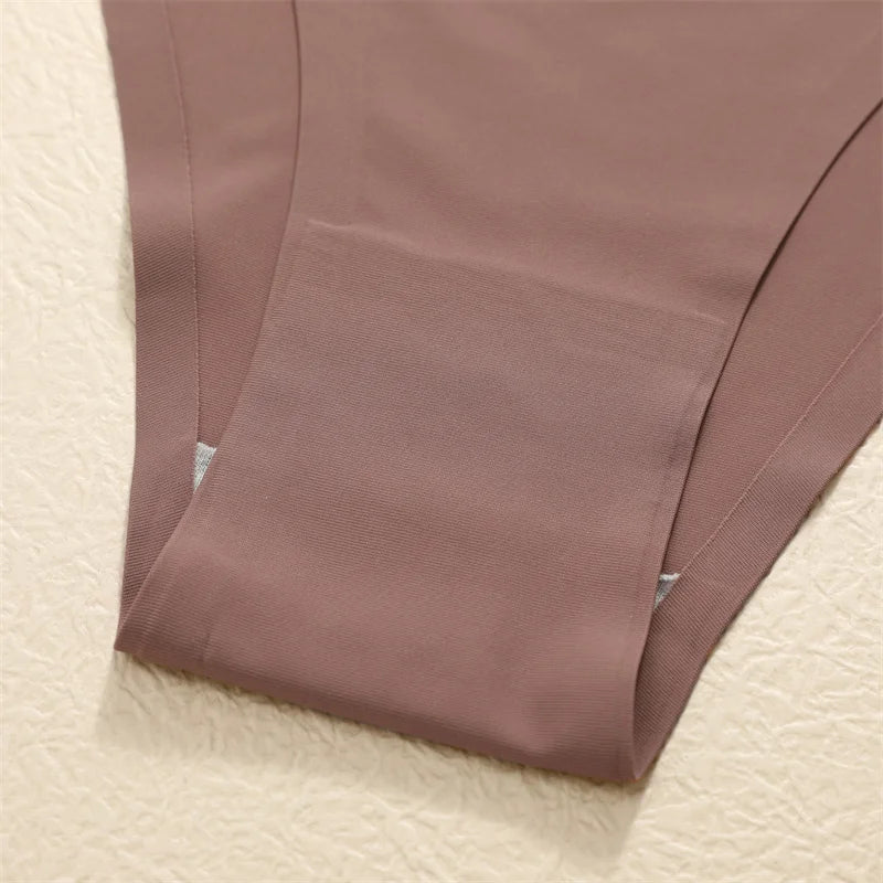 Brown fabric folded on a textured beige surface