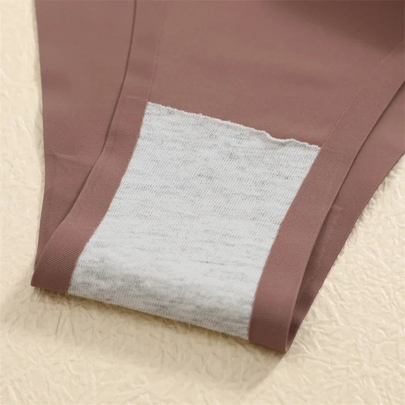 Close-up of a brown fabric with a textured gray square on a beige background