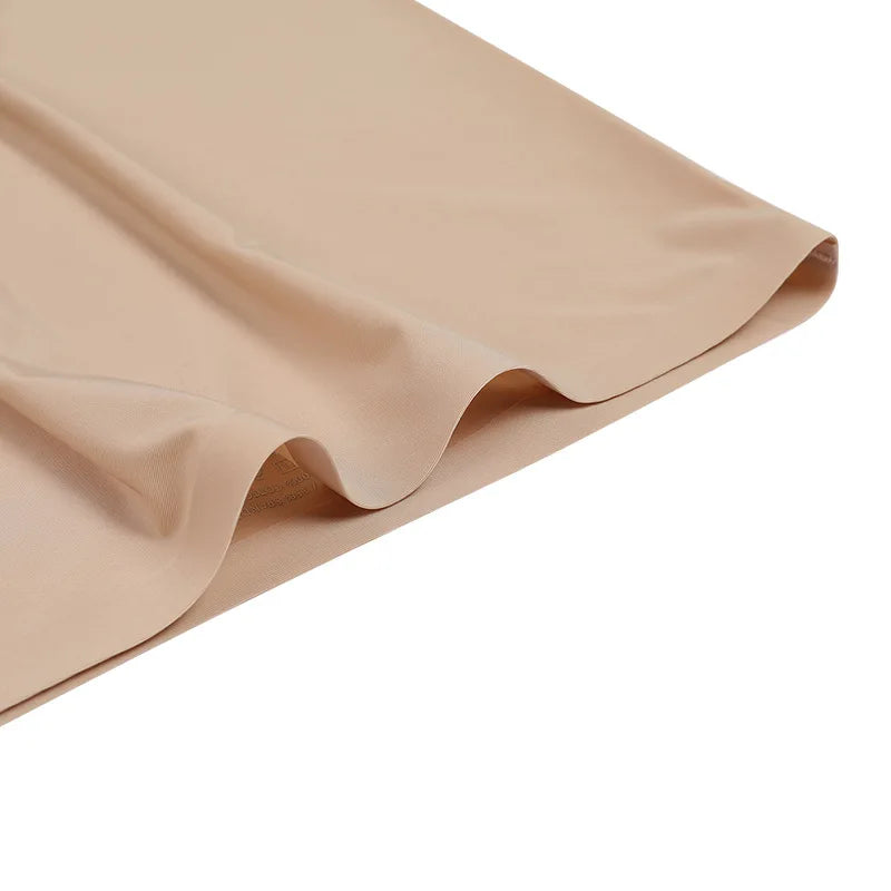 Beige fabric with a slight texture on a white background
