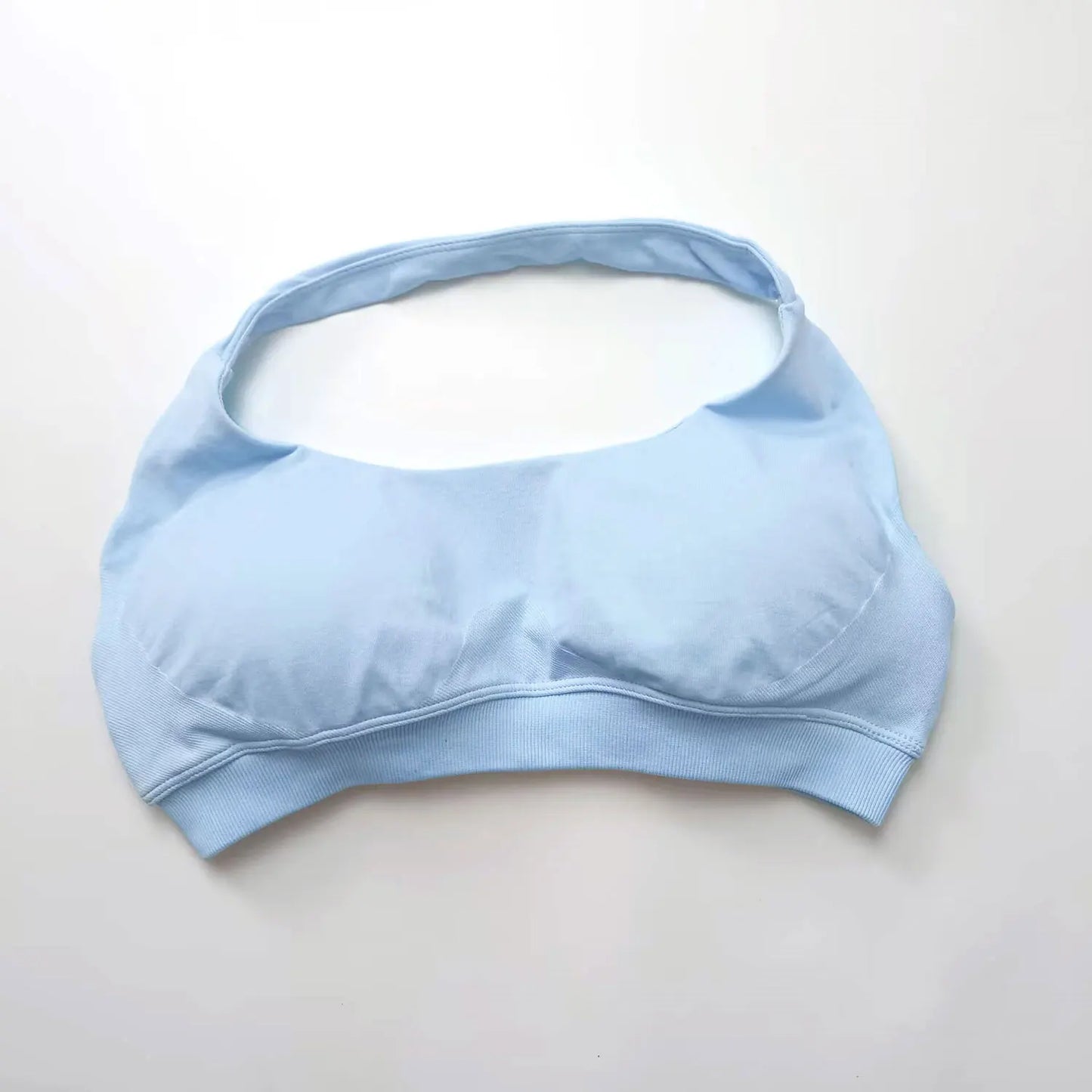 Light blue sports bra on a white background